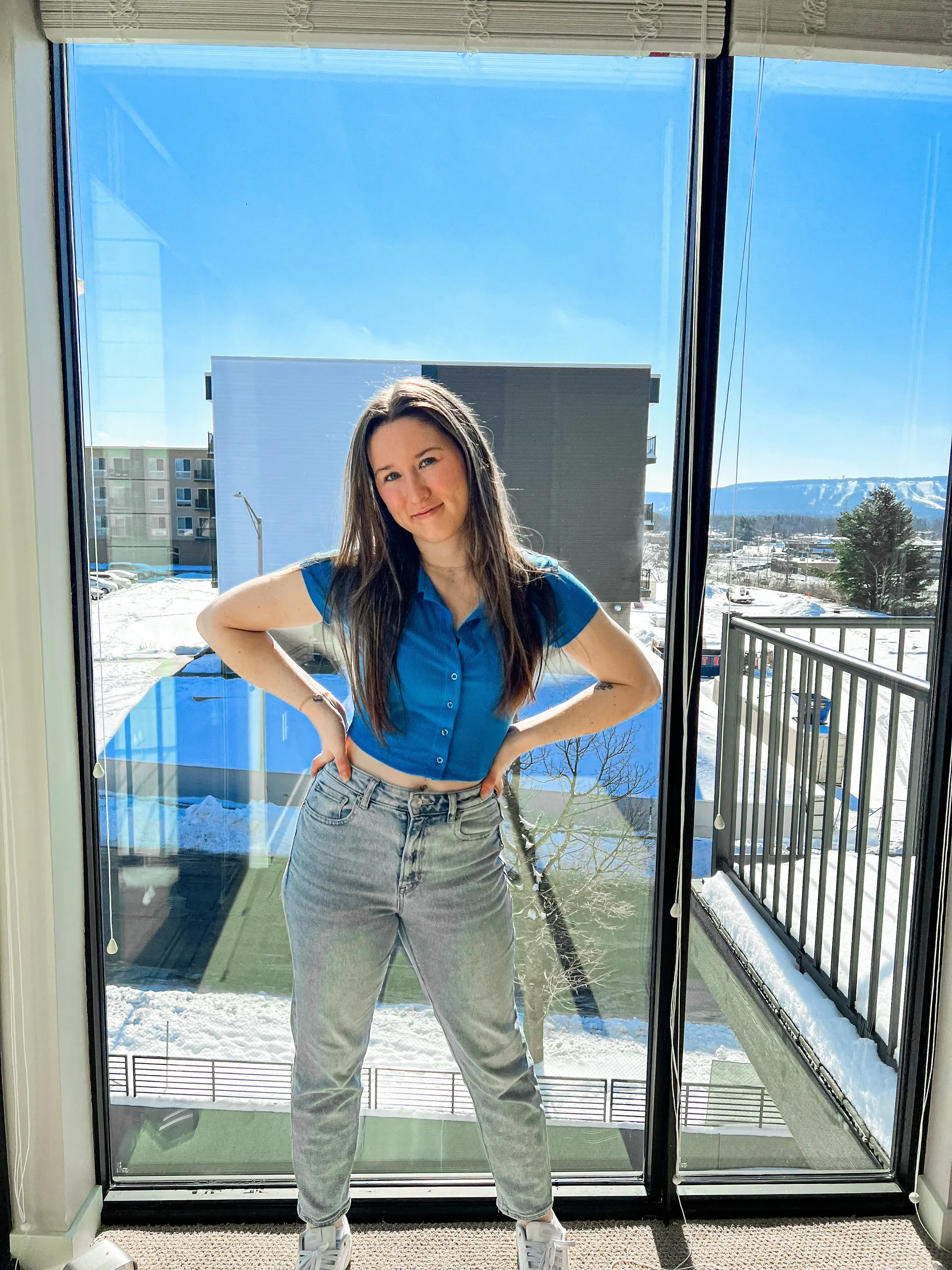 A resident on her balcony at bantr wausau